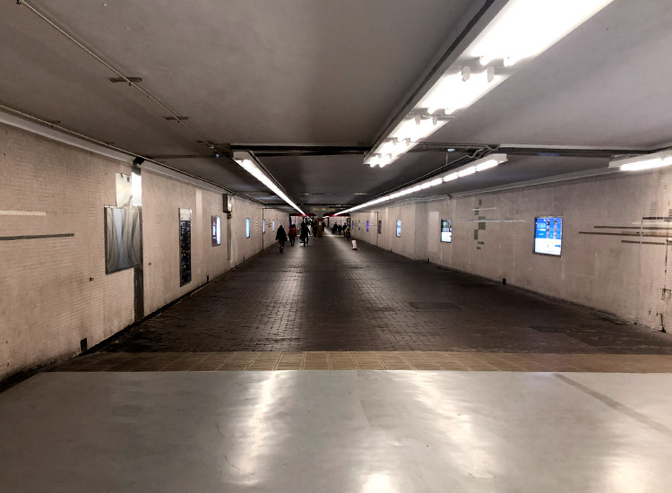 Walk straight along the underpass path for a little bit.